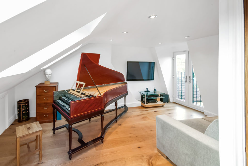 Find out the cost of an L-shaped Mansard conversion featuring a music room and French doors 