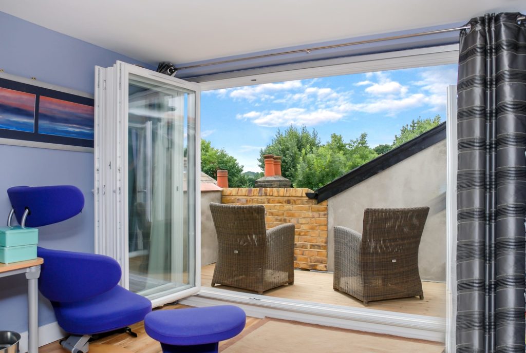 French doors leading to a roof terrace on a southfields dormer loft conversion